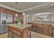 Well-appointed kitchen with an island and stainless steel appliances offers modern convenience at 9967 Pipestone St, Las Vegas, NV 89141