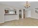 Inviting living room showcases an open floor plan, seamlessly connecting to the kitchen at 9967 Pipestone St, Las Vegas, NV 89141