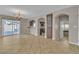 Open living space with tile floors and backyard access provides natural light and modern amenities at 9967 Pipestone St, Las Vegas, NV 89141