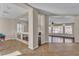 Open-concept living space with hardwood floors, columns, natural light and neutral paint at 9967 Pipestone St, Las Vegas, NV 89141