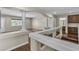 Loft with wood-look flooring and a view to a bathroom and another room at 9967 Pipestone St, Las Vegas, NV 89141