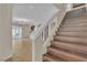 Elegant wood staircase leading to open living spaces at 9967 Pipestone St, Las Vegas, NV 89141