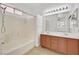 Bathroom featuring double vanity with a shower and bathtub combination at 100 Beaver Falls Ave, Las Vegas, NV 89123