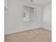 Bedroom featuring neutral carpet, large window, and ample natural light at 100 Beaver Falls Ave, Las Vegas, NV 89123