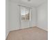 Bedroom featuring neutral carpet, large window, and ample natural light at 100 Beaver Falls Ave, Las Vegas, NV 89123