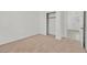 Bedroom featuring neutral carpet, closet, and ample natural light at 100 Beaver Falls Ave, Las Vegas, NV 89123
