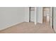 Bedroom featuring neutral carpet, closet, and ample natural light at 100 Beaver Falls Ave, Las Vegas, NV 89123