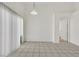 Open dining area featuring tiled flooring, neutral wall paint and a large window for natural light at 100 Beaver Falls Ave, Las Vegas, NV 89123