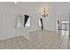 Bright living room featuring tile flooring, neutral decor, and an open layout with recessed lighting at 100 Beaver Falls Ave, Las Vegas, NV 89123