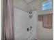 Well-maintained bathroom with shower-tub combination and storage shelving at 1012 Domnus Ln # 105, Las Vegas, NV 89144