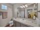 Well-lit bathroom with neutral colors, spacious counter, and modern fixtures at 1012 Domnus Ln # 105, Las Vegas, NV 89144