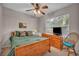 Comfortable bedroom with ceiling fan and large window for natural light at 1012 Domnus Ln # 105, Las Vegas, NV 89144
