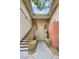 Condominium exterior featuring staircases, neutral walls and landscaping under a skylight at 1012 Domnus Ln # 105, Las Vegas, NV 89144