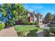 Inviting condo showcases mature trees, green lawn, assigned parking, and well-maintained landscaping at 1012 Domnus Ln # 105, Las Vegas, NV 89144