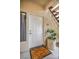 Apartment front door with a welcome mat and potted plant next to the unit number at 1012 Domnus Ln # 105, Las Vegas, NV 89144