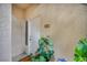 Apartment front door with a potted plant and welcome mat next to the unit number at 1012 Domnus Ln # 105, Las Vegas, NV 89144