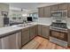 Modern kitchen with stainless steel appliances, ample counter space, and open access to the living area at 1012 Domnus Ln # 105, Las Vegas, NV 89144
