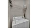 Efficient laundry area with a modern washing machine and storage shelves at 1012 Domnus Ln # 105, Las Vegas, NV 89144