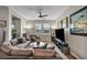 Inviting living room features hardwood floors, neutral paint, and a cozy fireplace at 1012 Domnus Ln # 105, Las Vegas, NV 89144