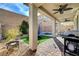 Backyard with covered patio, spa, grill, artificial turf, and a trampoline at 10397 Skye Canyon Falls Ave, Las Vegas, NV 89166