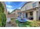 Backyard with spa, patio, trampoline, and grass at 10397 Skye Canyon Falls Ave, Las Vegas, NV 89166