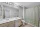 Neutral bathroom with a double sink vanity and shower with tub combo at 10397 Skye Canyon Falls Ave, Las Vegas, NV 89166