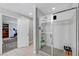 Modern bathroom with glass-enclosed shower and tiled walls, conveniently located near the main bedroom at 10397 Skye Canyon Falls Ave, Las Vegas, NV 89166