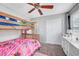 Bedroom featuring bunk bed, carpet flooring, closet, ceiling fan, and dresser at 10397 Skye Canyon Falls Ave, Las Vegas, NV 89166
