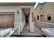 Inviting walkway leading to a welcoming front door with decorative wreath at 10397 Skye Canyon Falls Ave, Las Vegas, NV 89166