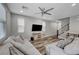 Bright living room features an open floor plan and hardwood floors at 10397 Skye Canyon Falls Ave, Las Vegas, NV 89166