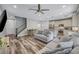 Open-concept living room showcases hardwood floors and abundant natural light at 10397 Skye Canyon Falls Ave, Las Vegas, NV 89166