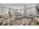 Open-concept living room and stainless appliances at 10397 Skye Canyon Falls Ave, Las Vegas, NV 89166