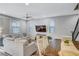Bright living room features an open floor plan and hardwood floors at 10397 Skye Canyon Falls Ave, Las Vegas, NV 89166