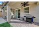 Covered patio with brick flooring, ceiling fan, grill, and outdoor furniture at 10397 Skye Canyon Falls Ave, Las Vegas, NV 89166