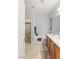 Bathroom featuring a tub, a large mirror and tile flooring at 1077 Lemongrass Ct, Henderson, NV 89002