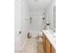 Bright bathroom featuring a shower-tub combination and single vanity with beige tile flooring at 1077 Lemongrass Ct, Henderson, NV 89002