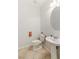 Cozy half bathroom features a pedestal sink and tile flooring at 1077 Lemongrass Ct, Henderson, NV 89002