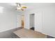 Bedroom with a ceiling fan, closet with sliding doors, and a view of the staircase at 1077 Lemongrass Ct, Henderson, NV 89002
