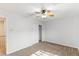 Bedroom with a ceiling fan, carpet, closet, and a view of the staircase at 1077 Lemongrass Ct, Henderson, NV 89002