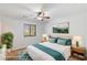 Bedroom featuring a ceiling fan and a bed with coordinating nightstands at 1077 Lemongrass Ct, Henderson, NV 89002