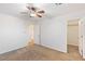 Bedroom featuring a ceiling fan, closet, and a view of the hallway at 1077 Lemongrass Ct, Henderson, NV 89002