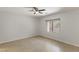 Spacious bedroom with neutral tones, large window and tiled flooring at 1077 Lemongrass Ct, Henderson, NV 89002