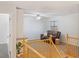Bright room with carpeted flooring, ceiling fan, and wood railing with a comfortable leather couch at 1077 Lemongrass Ct, Henderson, NV 89002