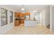Well-lit kitchen featuring wooden cabinetry, modern appliances, and a breakfast bar, perfect for casual dining at 1077 Lemongrass Ct, Henderson, NV 89002