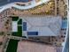 Birds eye view of property featuring a modern roof with solar panels surrounded by a landscaped yard and neighborhood at 12453 Foxtail Run Ave, Las Vegas, NV 89138
