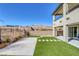 Enjoy the outdoors with a patio and grass in this backyard at 12453 Foxtail Run Ave, Las Vegas, NV 89138