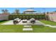 This backyard has a patio lounge area and artificial turf at 12453 Foxtail Run Ave, Las Vegas, NV 89138