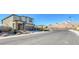 View of the home's exterior showcasing modern design and mountain views at 12453 Foxtail Run Ave, Las Vegas, NV 89138