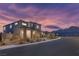 Well-manicured home exterior with xeriscaping and stunning mountain views at 12453 Foxtail Run Ave, Las Vegas, NV 89138