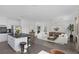 Open concept living room featuring hardwood floors, modern design, and stainless steel appliances at 12453 Foxtail Run Ave, Las Vegas, NV 89138